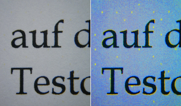 A close image of printed text under white and blue light.
